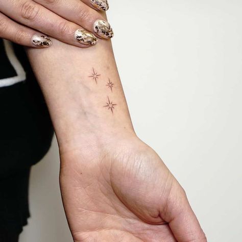 Small Tattoo Ideas For The Subtle Body Art Lover – Self Tattoo Arm Star Tattoos For Women, 5 Star Tattoo Designs, Simple Delicate Tattoos, Five Stars Tattoo, Stars Tatoos Ideas, Star On Hand Tattoo, Art Lover Tattoo, Cool Star Tattoos, Stars Wrist Tattoo