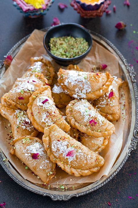 Crispy and flaky traditional Gujiya recipe is rich and delicious. Packed with the goodness of desiccated coconut and dry nuts, its a perfect sweet for any Indian festival. #gujiya #karanji #howtomakegujiya #holisweets #diwalisweets #happydiwali Gujia Recipe Indian, Gujiya Recipe Indian, Gujarati Sweets, Holi Ideas, Holi Sweets, Gujiya Recipe, Food Polls, Guyanese Food, Indian Fast Food