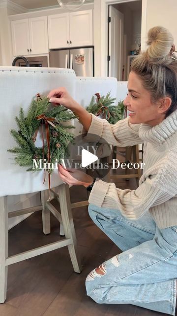 Alexandra Harper on Instagram: "🎄 Probably the easiest little DIY decor project! Can also be hung on cabinets, dining room chairs and etc.   I used long push pins since our chairs are linen but for anything else just use small command hooks!  ✨Comment WREATHS to shop or click my LTK shop in my bio   • • • #christmasdecorating #christmaswreaths #diyholidaydecor #diychristmasdecor #holidayinspo #holidaydecorations #targethome" Christmas Dining Room Chair Decor, Decorate Dining Chairs For Christmas, Christmas Wreath Dining Chairs, Christmas Wreaths On Chair Backs, Chair Christmas Decorations, Wreath On Chair Back, Christmas Dining Chair Decor, Small Wreaths On Cabinets, Cabinet Wreath Kitchen