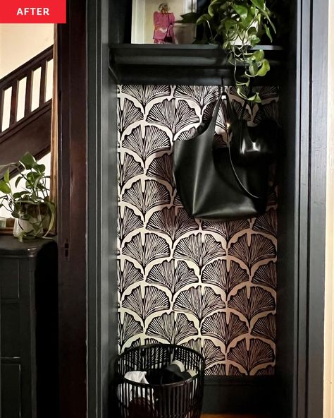 A black bag hanging in a black and white closet Wallpaper And Colored Trim, Wallpaper In Closets, Coat Closet Wallpaper, Wallpaper Coat Closet, Wallpaper Inside Closet, Black Closet Interior, Wallpaper Closet Ideas, Painted Closet Interior, Closet Painting Ideas