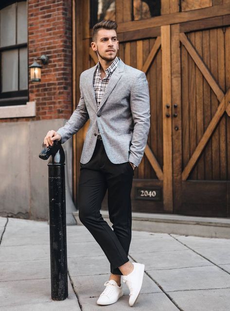 Modern and versatile: grey blazer, white and black dress shirt, black dress pants, and white sneakers. Ideal for business casual settings and social events. Formal Dressing Style For Man, Grey Blazer Black Pants, Grey Jacket Black Pants, Grey Blazer Outfit, Black Dress Pants Men, Black Pants Outfit, Black Plaid Shirt, Grey Suit Jacket, Pants Outfit Men