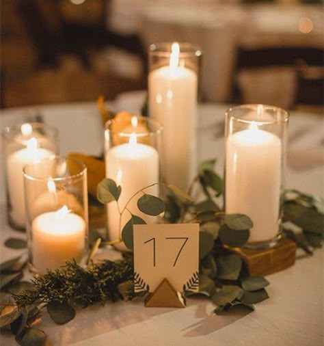 Centerpieces with seeded eucalyptus, gold accents, glass cylinders. Round Table Centerpieces, Romantic Centerpieces, Rehearsal Dinner Decorations, Frugal Wedding, Tafel Decor, Wedding Floral Centerpieces, Dinner Decoration, Wedding Table Decorations, Candle Centerpieces