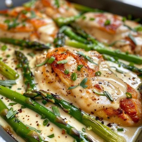 If you’re yearning for a meal that’s quick enough for a busy weekday yet has all the trappings of a leisurely Sunday dinner, then this Caesar Chicken with Asparagus recipe is your answer. It’s a sophisticated twist on the classic Caesar salad, transforming it into a warm, inviting main course that's sure to impress. This dish marries the creamy, tangy flavors of Caesar dressing with juicy chicken and crisp asparagus, creating a symphony of flavors in one pan—and who doesn’t love minimal ... Caesar Chicken And Asparagus, Cesar Chicken With Asparagus, Parmesan Caesar Chicken, Ceasar Chicken Asparagus, Chicken Caesar Casserole, Caesar Chicken With Asparagus, Chicken Cesar Cutlet, Chicken With Asparagus Recipes, Chicken And Asparagus Recipes