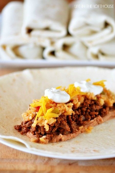 Freezer Beef and Bean Burritos a must try. refried beans, ground beef,rice, cheese and a dollop of sour cream. burrito size tortillas. freeze. good 2 months. Beef And Bean Burritos, Life In The Lofthouse, Beef Burritos, Freeze Ahead Meals, Frozen Burritos, Bean Burritos, Make Ahead Freezer Meals, Freezer Breakfast, Menu Plan