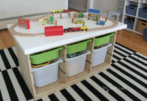 17 IKEA Toy Storage Hacks (To Make Your Home Beautiful Again) Ikea Train Table Hack, Ikea Kallax Playroom Montessori, Ikea Dundra Table Hack, Dundra Table Hack, Ikea Dundra Table, Dundra Table, Ikea Headboard Hack, Ikea Shelf Hack, Table Lego