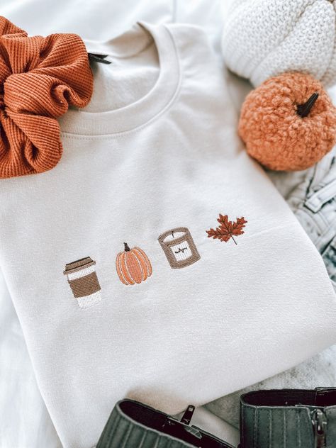 Give me alll the fall things! Say hello to your new favorite embroidered fall sweater Please note, this is a PRE-ORDER. Please allow 1-2 weeks for processing time. All other items in your order will be shipped at the same time.  Material: 50/50 polyester cotton blend, Gildan Softstyle crewneck White T-shirt With Embroidered Text For Fall, Fall Cotton Sweater With Letter Embroidery, Cozy Letter Embroidery Sweatshirt For Fall, Cozy Fall Sweatshirt With Letter Embroidery, Fall Embroidered Graphics Cotton T-shirt, Cozy Sweatshirt With Letter Embroidery For Fall, Fall Cotton T-shirt With Embroidered Graphics, Custom Embroidery Long Sleeve T-shirt For Fall, White T-shirt With Custom Embroidery For Fall