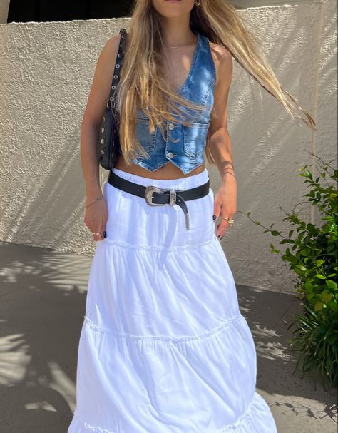 #fashion #whiteskirt #aesthetic #summerstyle #coachella #trendy #trendystreetstyle #trendysummeroutfits #country #cowgirl #boots #whiteskirt #tieredskirt #denim #denimvest #levi #dolcevita #stevemadden #coquette #beach Denim Vest Outfit Summer, White Skirt Denim, White Denim Skirt Outfit, White Tiered Skirt, Denim Vest Outfit, 2024 Era, Long White Skirt, Eras Outfit, Country Cowgirl