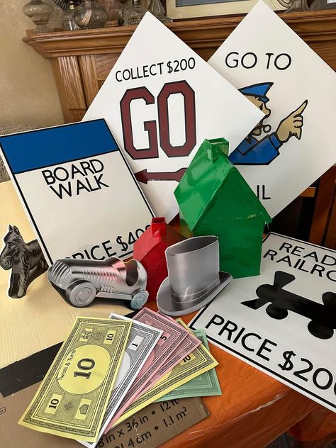 Monopoly Hallway Theme, Monopoly Centerpiece Table Settings, Monopoly Decorations Themed Parties, Giant Monopoly Pieces, Operation Game Decorations, Game Night Decorations Ideas Diy, Monopoly Parade Float, Monopoly Hallway Decorations, Board Game Hallway Decorations