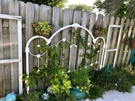 Upcycled iron headboard and old cupboard doors Metal Headboard Repurpose, Old Metal Headboard Ideas Reuse, Iron Headboard Repurpose, Iron Headboard Garden Ideas, Iron Headboard Ideas, Headboard Garden Ideas, Metal Headboard Ideas Repurposed, Repurposed Metal Headboard, Diy Backyard Garden