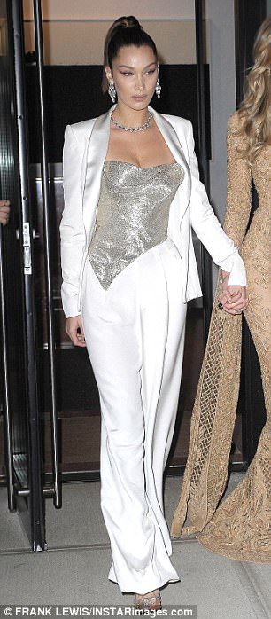 Chic: The Nike Air Force 1 spokesmodel opted for a white silk pantsuit with a glittery silver bustier and translucent pumps for her sibling's big night White Pantsuit Outfit, Bella Hadid Suit, Silver Top Outfit, White And Silver Outfit, White Suits For Women, White Suit Outfit, White Suit Women, Women's Pant Suits, Gold Lace Gown