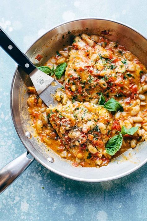 Garlic Basil Barramundi Skillet with Tomato Butter Sauce! SO YUMMY and super easy, with basic ingredients like garlic, basil, tomatoes, white beans, Parmesan, and white fish. Perfect with a green salad and crusty bread. #glutenfree #sugarfree #dinner #easymeal #simplerecipe | pinchofyum.com Beans Parmesan, Tomato Butter Sauce, Tomato Butter, Summer Seafood Recipes, White Fish, Think Food, Crusty Bread, Butter Sauce, Fish Dishes