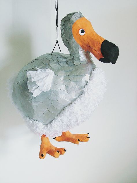 Silver dodo bird pinata! Fluffy chest made with folded crepe paper and silver back with paper-punched tissue paper. Beak is painted in acrylics and highlighted with colored pencil. Recently listed at my shop: https://www.etsy.com/listing/203879430/sale-pinata-dodo-rts-s #wedding #birthday #elegant How To Make Pinata, Birthday Elegant, Dodo Bird, Bird Beaks, Tiki Lounge, Bird Party, Pirate Birthday Party, White Rabbits, Pirate Birthday