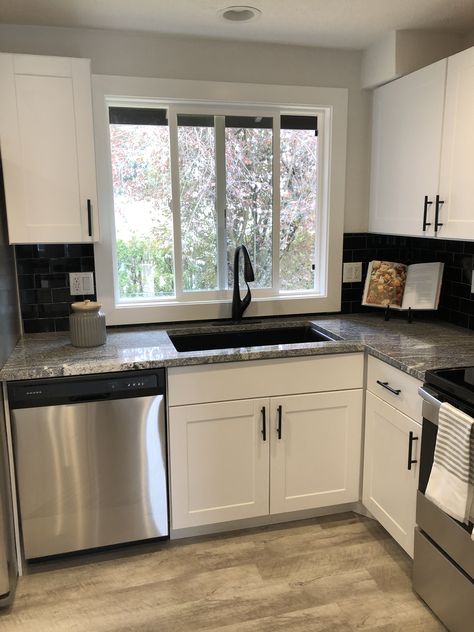 Black Sink In White Kitchen, Black Sink Kitchen Grey Countertop, White Cabinet And Dark Countertop, Kitchen Black Sink And Faucet, Black Sink White Cabinets, White Upper And Black Lower Cabinets, Black Faucet Black Countertop, Black Granite Sink Kitchen, Kitchen With Black Sink And Faucet