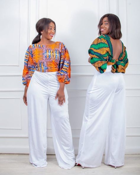 Brunch in style! Meet your new favorite piece: our African Print Tie Crop Top. It’s vibrant, fun, and perfect for those brunch outings with friends. Dress it up with white palazzo pants for a look that’s both stylish and comfortable. 🛍️ Don’t wait-shop now and show off your unique style! #AfricanPrint #CropTop #InstaReady #BrunchStyle #FashionGoals #Togolese #TogoFashion #TogoTrends #TogoShop #TogoTrends Ogansia Top Styles, White Tie Back Crop Top, Long Sleeve Tie Back Top For Brunch, White Tie-back Top For Brunch, White Tie Back Blouse For Day Out, Ankara Palazzo Pants And Top, African Print Tops With Jeans, Palazzo And Top, African Print Shirts