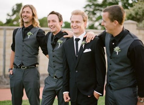 Black tux for groom, groomsmen in dark gray with black shirts Black Shirt Black Vest Men Groomsmen, Dark Gray Groomsmen Attire, Black And Grey Groomsmen, Black And Gray Groomsmen Attire, Black Vest Groomsmen, Grey And Black Groomsmen Suits, Black And Grey Groomsmen Attire, Black Shirt Groomsmen, Black Shirt Groom