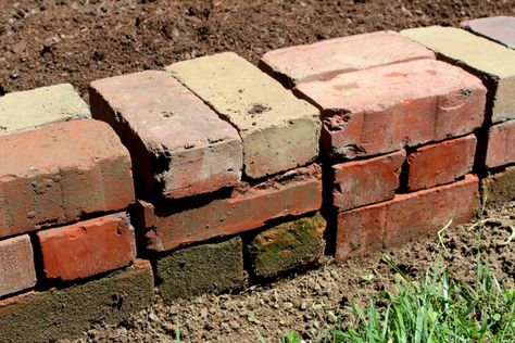 higgledy-piggledy garden wall | Modern June Wood Edging Landscape Garden Borders, Raised Bed Brick, Brick Raised Garden Beds Diy, Repurposed Brick Ideas, Red Brick Garden Ideas, Bricks With Holes Ideas, Brick Edging For Flower Beds, Old Bricks Ideas Diy, Brick Planter Ideas