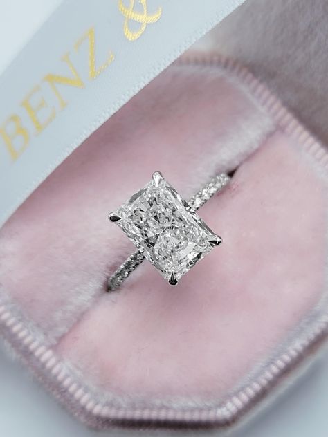 This astonishing 3.54 carats ring has a 3.02 carat lab grown elongated radiant cut center diamond and is IGI certified at "F" in color and "VS1" in clarity, (Excellent Cut, Polish and Symmetry) and is set in a classy side stones hidden halo setting in 14K white gold. The ring can also be made in yellow/rose gold or pla Elongated Radiant, Dark Wedding Theme, Radiant Cut Engagement Rings, Radiant Engagement Rings, Future Engagement Rings, Engagement Inspo, Emerald Engagement Ring Cut, Halo Setting, Dream Engagement