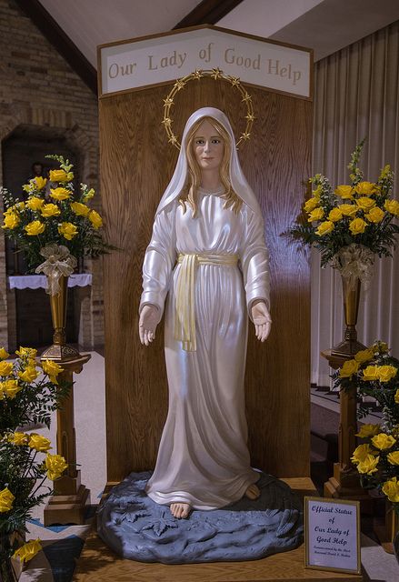 This is the new statue of Our Lady of Good Help at the shrine of the first approved Marian apparition in the United States at Champion, Wisconsin. It was made in the likeness of what Adele Brise reported that she saw.  According to Adele, Mary was "clothed in dazzling white, with a yellow sash about her waist. Her dress fell to her feet in graceful folds. She had a crown of stars around her head, and her long golden wavy hair fell loosely over her shoulders." Our Lady Of Good Help, Crown Of Stars, Marian Shrines, The Apparition, The Blessed Mother, Mary Immaculate, Marian Apparition, Mary Art, Virgin Mary Art