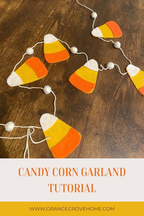 A candy corn garland laying on a table Simple Fall Decor Diy, Candy Corn Garland, Corn Garland, Simple Fall Decor, Halloween Mantel Decor, Garland Tutorial, Felt Yarn, Halloween Mantel, Fall Garland