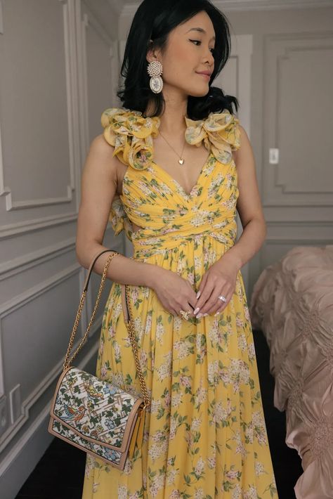 Lily wearing a yellow floral maxi dress from Dillards. This a beautiful dress for any occasion. Yellow Garden Party Dress, Yellow Floral Dress Outfit, Multicolor Floral Dress, Wedding Guess Dress, Feminine Summer Outfits, Yellow Floral Maxi Dress, Floral Dresses With Sleeves, Floral Dress Wedding Guest, Floral Dress Outfits