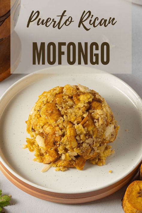 Mofongo is a popular Puerto Rican dish made with fried green plantains mashed with chicharrones (crispy pork skin) and garlic. Mafalda Recipes, Empanadas Recipe Puerto Rican, Puerto Rican Food Authentic, Puerto Rican Appetizers Parties, Mofongo Recipe Puerto Rican, Easy Puerto Rican Recipes, Easy Mofongo Recipe, Vegan Mofongo, Puerto Rican Mofongo Recipe