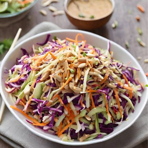 Asian Slaw with Peanut Dressing - Whether you're hosting a summer BBQ or looking for a refreshing side dish to complement your plant-based feast, this Asian Slaw will surely steal the show! What elevates this slaw to new heights is my special peanut dressing, boasting a perfect balance of sweet maple syrup, tangy rice vinegar, creamy peanut butter, and a kick of sriracha for that extra spicy punch! Coopers Hawk Asian Slaw Recipe, Peanut Butter Coleslaw, Thai Slaw With Peanut Dressing, Asian Coleslaw Dressing, Peanut Slaw, Salad Sides, Asian Slaw Recipe, Broccoli Slaw Salad, Asian Coleslaw