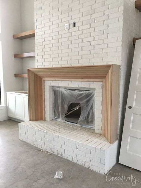 Client Project Updates: Back From Long Break Fireplace With Doors On Both Sides, French Country Fireplace Mantels, Brick Hearth Makeover, Brick And Cast Stone Fireplace, Fireplace Raised Off Floor, Low Profile Fireplace Hearth, New Construction Fireplace Ideas, Removing Brick From Fireplace, Modernize Brick Fireplace