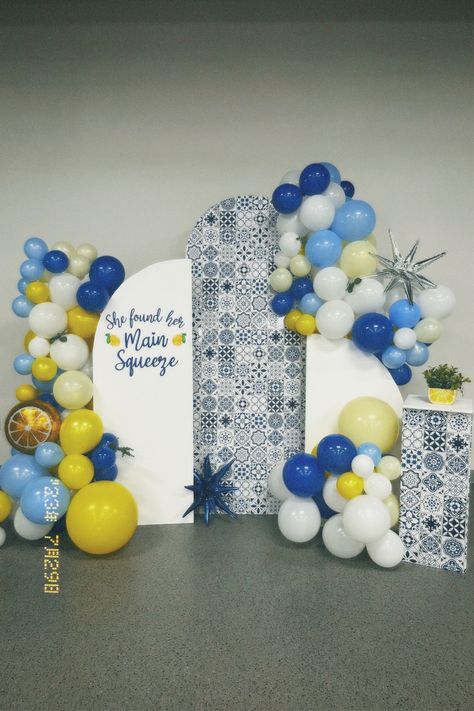 Blue and yellow balloon arch and cluster on arch backdrop trio with accent table. She found her main squeeze theme with shades of blue and lemon accents. She Found Her Main Squeeze Balloon Arch, Blue And Yellow Bachelorette Party, She Found Her Main Squeeze Backdrop, Blue And Yellow Balloon Arch, Hacienda Party, Yellow Balloon Arch, Italian Engagement, Balloon Arch Backdrop, Bday Plans