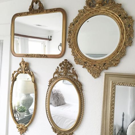 Multiple mirrors on wall