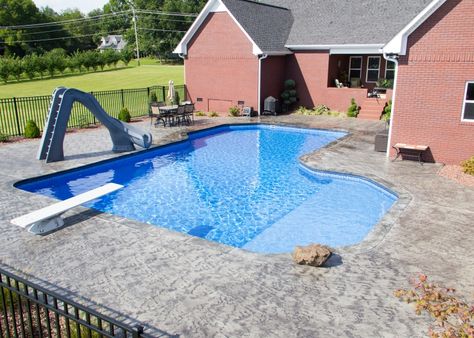 Inground Pool Photo Jonesboro | Gunite Pool Cape Girardeau | Union City - Somerset Grecian Vinyl Inground Diving Pool with Corner Step, Tanning Ledge, Slide, Concrete Coping, and Custom Patio(1) Inground Pool With Diving Board, Vinyl Pool With Tanning Ledge, L Shaped Pool With Tanning Ledge, Pool With Tanning Ledge, Vinyl Pools Inground, Pool Layout, Cocktail Pool, Pool Paradise, Tennessee House