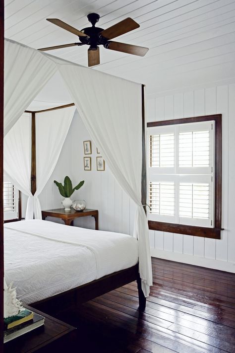 A new book reveals how the design and architecture of seaside homes are influenced by their setting | archdigest.com British West Indies Style Bedroom, Tropical British Colonial Interiors, Caribbean Bedroom, Modern British Colonial, British Colonial Bedroom, Colonial Style Bedroom, Tropical British Colonial, Colonial Bedroom, British Colonial Decor