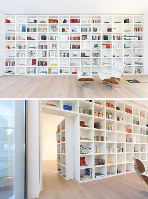 When it's closed, this secret door blends in completely with the other shelving units in this large wall of white bookshelves. Loft Conversion Design, Hidden Room, Bookshelf Door, Murphy Door, White Bookshelves, Bookcase Door, Hidden Spaces, Home Library Design, Hidden Rooms