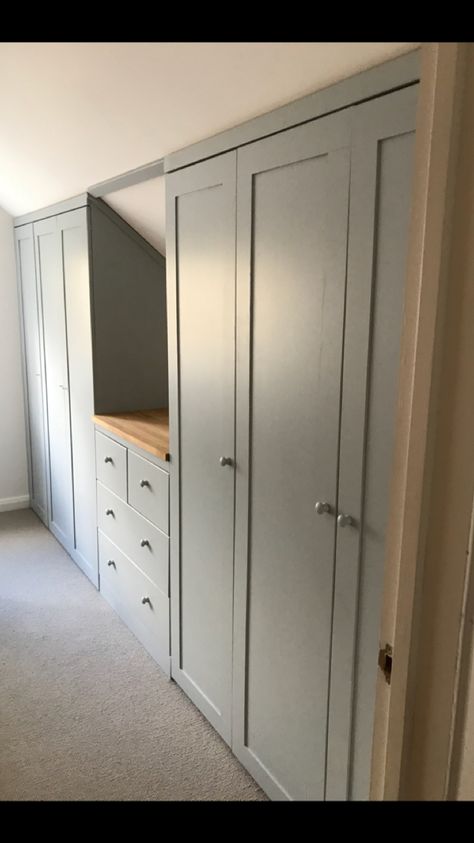 Loving our new built in wardrobes. Difficult space due to sloping ceiling now filled with lots of lovely storage Built In Attic Closet, Built In Storage Slanted Ceiling, Loft Built In Storage, Closet In Loft Space, Closet Attic, Vaulted Ceiling Bedroom Storage, Pitched Ceiling Storage, Pitched Ceiling Hallway, Sloping Ceiling