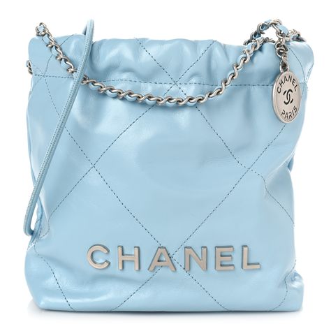 This is an authentic CHANEL Shiny Calfskin Quilted Mini Chanel 22 in Light Blue. This stylish handbag is crafted of diamond-stitched calfskin leather in light blue. The bag features leather threaded silver chain shoulder straps and a matching Chanel logo on the front. The open top with magnetic closure leads to a matching fabric interior with a patch pocket. Chanel 22 Bag, Mini Chanel, Chanel 22, Chanel Logo, Leather Thread, Bag Light, Open Top, Magnetic Closure, Capsule Wardrobe