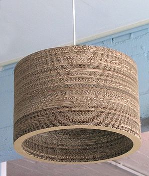 A recycled cardboard lampshade. Cardboard Lampshade, Cardboard Lamp, Symmetrical Balance, Basement Lighting, Cardboard Design, Cardboard Box Crafts, Cardboard Sculpture, Ceiling Ideas, Diy Chandelier