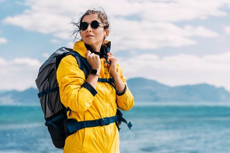 Portrait of a female traveler on the background of the sea. The concept of adventure, travel and hiking. A female tourist enjoys a beautiful landscape during a hike. Portrait of a tourist by the sea Sea Background, A Sea, By The Sea, Female Travel, Fjallraven Kanken Backpack, Beautiful Landscapes, Adventure Travel, The Sea, Hiking