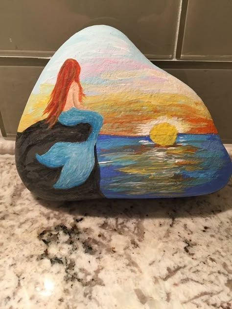 Mermaid Watching Sunset painted rock Acrylic Painting Rocks, Beach Sunset Painting, Watching Sunset, Dengeki Daisy, Art Pierre, Stone Art Painting, Seashell Painting, Mermaid Painting, Painted Rocks Kids