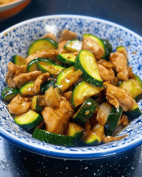 Quick and Flavorful Chicken Zucchini Stir Fry When it comes to weeknight dinners, nothing beats a quick and flavorful stir fry. This Chicken Zucchini Stir Fry is a perfect example ... Read more Stir Fry Bowl Recipes, Chicken Thigh Recipes Zucchini, Low Cal Chicken Stir Fry, Chicken Zucchini Bowl, Chicken Zucchini Stir Fry Recipes, Chicken Stir Fry With Zucchini And Squash, Recipes With Chicken And Zucchini, Garlic Chicken Stir Fry Recipes, Wok Stir Fry Recipes