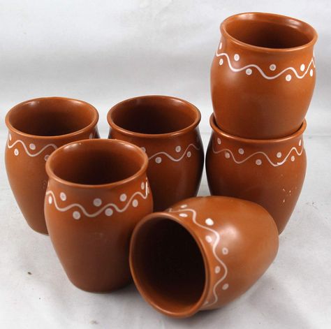 About this item
Hand crafted by rural artisans of Puri,Odisha
Color - Brown
Capacity - 160 ml each; Size in Inches ( Dia x H ) - 2 x 3
Set contents - 6 Ceramic cups
Care instructions : Wash with normal detergent by hand Holi Ideas, Hot Chai Tea, Indian Chai Tea, Indian Ceramics, Indian Chai, Mexican Party Decorations, Indian Home Design, Indian Pottery, Dinning Set