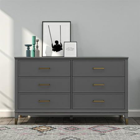 Organize your wardrobe in style with the CosmoLiving by Cosmopolitan Westerleigh 6-Drawer Dresser. The Westerleigh is accented by trendy brassy gold hardware with six spacious drawers to hold all of your #ootd. The top surface provides room for all of your chic obsessories, and a wall anchor kit is provided to prevent tipping injuries. Available in white, graphite gray, pink, or matte black, this dresser will nail the decor game. Dresser Flips, Gold Drawer Pulls, Red Living, Grey Dresser, Cosmoliving By Cosmopolitan, 4 Drawer Dresser, 6 Drawer Chest, Wood Dresser, Modern Dresser