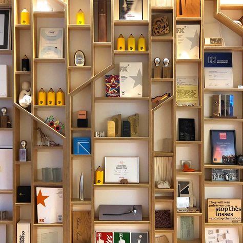 Awards Display Office, Trophy Shelf Design, Office Awards Display, Awards Display Wall Offices, Award Display Wall Trophy Shelf, Trophy Stand Display, Award Display Ideas Office, Award Display Wall, Trophy Shelf Ideas Interior Design