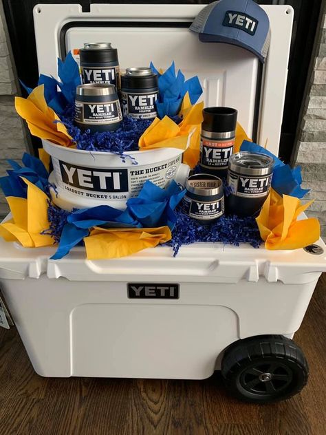 #yeti #rafflebasketideas #raffle #colster #tumbler #loadout #haulroller #tundrahaulroller #yetihat #fundraising #fundraiserideas #fundraiser #rambler #ramblerbottle #yetiwinetumbler #cooler #coolerpackage #scholarships Cooler Raffle Basket Ideas, Yeti Gift Basket, Cooler Gift Basket Ideas, Cooler Gift Basket, Raffle Gift Basket Ideas, Silent Auction Basket, Auction Gift Basket Ideas, Chinese Auction, Fundraiser Raffle