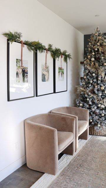 Garland Above Picture Frame, Hanging Pictures With Ribbon Wall Art, Decorating Picture Frames For Christmas, Garland Over Picture On Wall, Wreath Gallery Wall, Christmas Picture Decoration Ideas, Garland Around Picture Frame, Wrapped Frames On Wall Christmas, Bows On Picture Frames Christmas