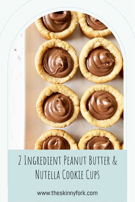 Who wants some 2 Ingredient Peanut Butter & Nutella Cookie Cups? These are easy peasy peanut butter cookie cups that are stuffed with hazelnut spread and perfect to enjoy as a sweet snack! TheSkinnyFork.com | Skinny & Healthy Recipes Nutella Peanut Butter Recipes, Nutella Cookie Cups, Peanut Butter Nutella Cookies, Peanut Butter Cookie Cups, Nutella Cookie, Nutella Recipes Easy, Butter Cookie Dough, Nutella Muffins, Peanut Butter Nutella