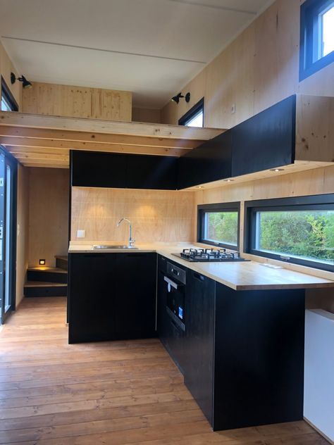 Sleek Black THOW by Tiny House Manufaktur Dark Tiny Home Interior, Black Tiny House Interior, Container Kitchen Design, Black And White Tiny House, Black Interior Tiny House, Black Modern Tiny House, Tiny House Gothic, Tiny House Black, Small Black Kitchen Ideas