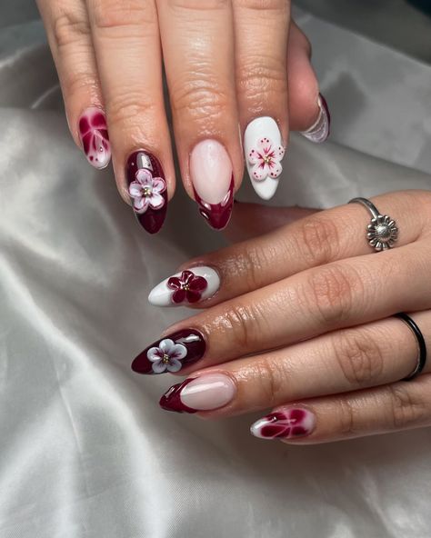 Burgundy and flowers 🌸🥀 • • • #nails #gelxnails #gelx #dfwgelxnailtech #dfwgelx #almondnails #fallnails #mediumnails #3dflowernails #burgundynails #whitenails #fallnails #dfwnails #dfwnailtech #irvingnails #irvingnailtech Flowers Nails, 3d Flower Nails, Burgundy Nails, Nail Tech, Almond Nails, White Nails, Nails, Flowers, Quick Saves