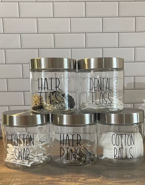 #bathroomdecorideas #organization #bathroomorganization Jars For Bathroom Storage, Qtip Holder Bathroom Glass Jars, Small House Organization Ideas Bedroom, Glass Jars For Bathroom, Realistic Bathroom Organization, Bathroom Containers Jars, Clever Bathroom Ideas, New House Organization Ideas, Bathroom Canister Ideas