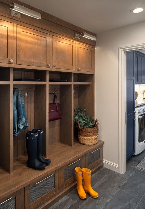 Tips for Organizing Your Mudroom; Creating an organized place to stash boots, hats, and the keys is the perfect way to end a busy day. Here are all the mudroom organization pointers you'll need! Transitional Entryway Ideas, Transitional Mudroom, Stained Wood Cabinets, Transitional Entry, Wood Lockers, Mudroom Remodel, Mudroom Cabinets, Entryway Design, Living Room Transformation