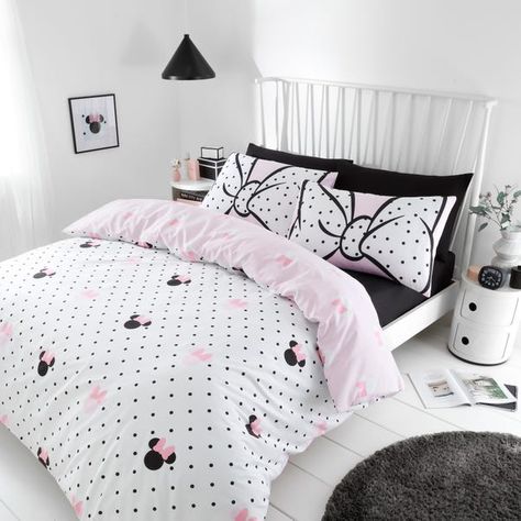 * Made from soft polycotton * Includes standard pillowcase(s) * Minnie Mouse print * Reversible design * Machine washable Perfect for your Minnie Me, this Minnie Mouse duvet cover and pillowcase set features a pretty black and white polka dot print with Minnie Mouse head shapes on one side and a Minnie Mouse head shaped print on the reverse on a baby pink background, making this bedding set interchangeable for quick style whenever they desire. Crafted from a soft blend of polyester and cotton material, this set is easy to care for and is fully machine washable. The duvet cover set has been finished with a secure button closure which helps secure the cover around the duvet whilst in use and includes a matching reversible pillowcase(s) for a complete look.This product is OEKO-TEX® MADE IN GR Toddler Girl Bedroom Themes, Minnie Mouse Bedroom Decor, Minnie Mouse Bedding, Minnie Mouse Bedroom, Baby Pink Background, Grown Up Bedroom, Minnie Mouse Head, Big Girl Bedrooms, Cute Bedding