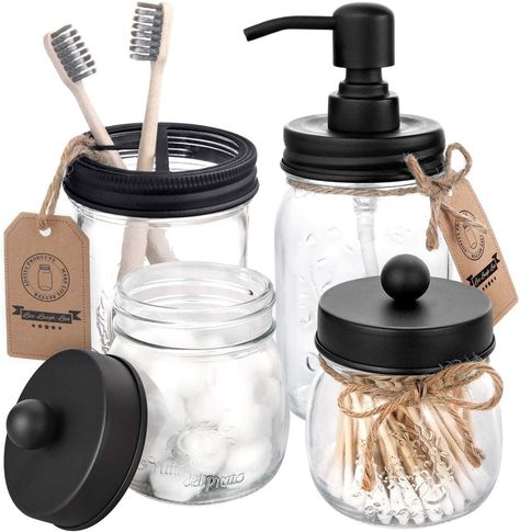 A mason jar bathroom set to (stylishly) hold your toothbrushes, soap, cotton balls, and more. Each set comes with four jars and various black lids to bring the look together. Apothecary Jars Bathroom, Rustic Bathroom Accessories, Mason Jar Toothbrush Holder, Bathroom Vanity Organization, Mason Jar Holder, Country Bathroom Decor, Bathroom Jars, Vanity Organizer, Mason Jar Soap Dispenser